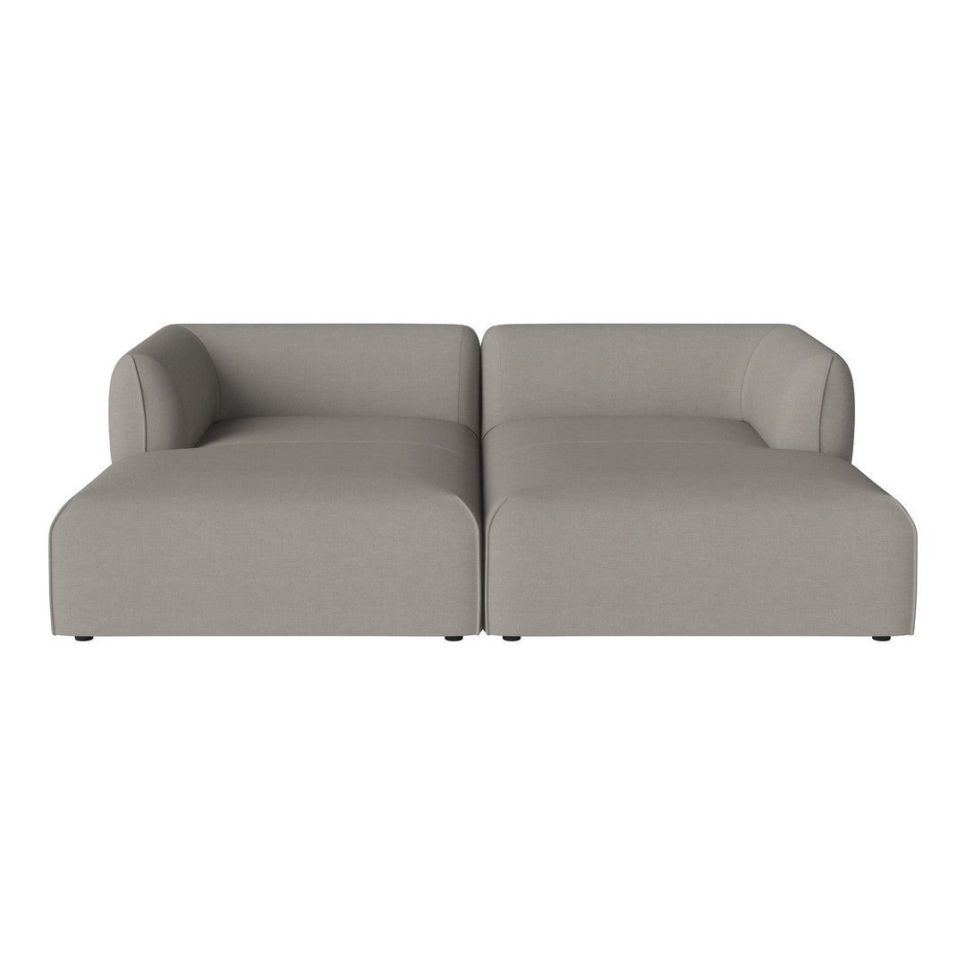 Light gray modular sofa with a smooth, minimalist design and rounded arms, perfect for modern décor.