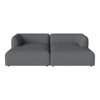 Gray two-seater sofa with a modern, minimalistic design and smooth, solid fabric upholstery.