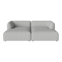 Light gray two-piece sectional sofa with smooth, modern lines and minimalistic design.