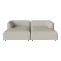 Sleek beige sofa with smooth, minimalist design and no visible patterns. Perfect for modern living spaces.