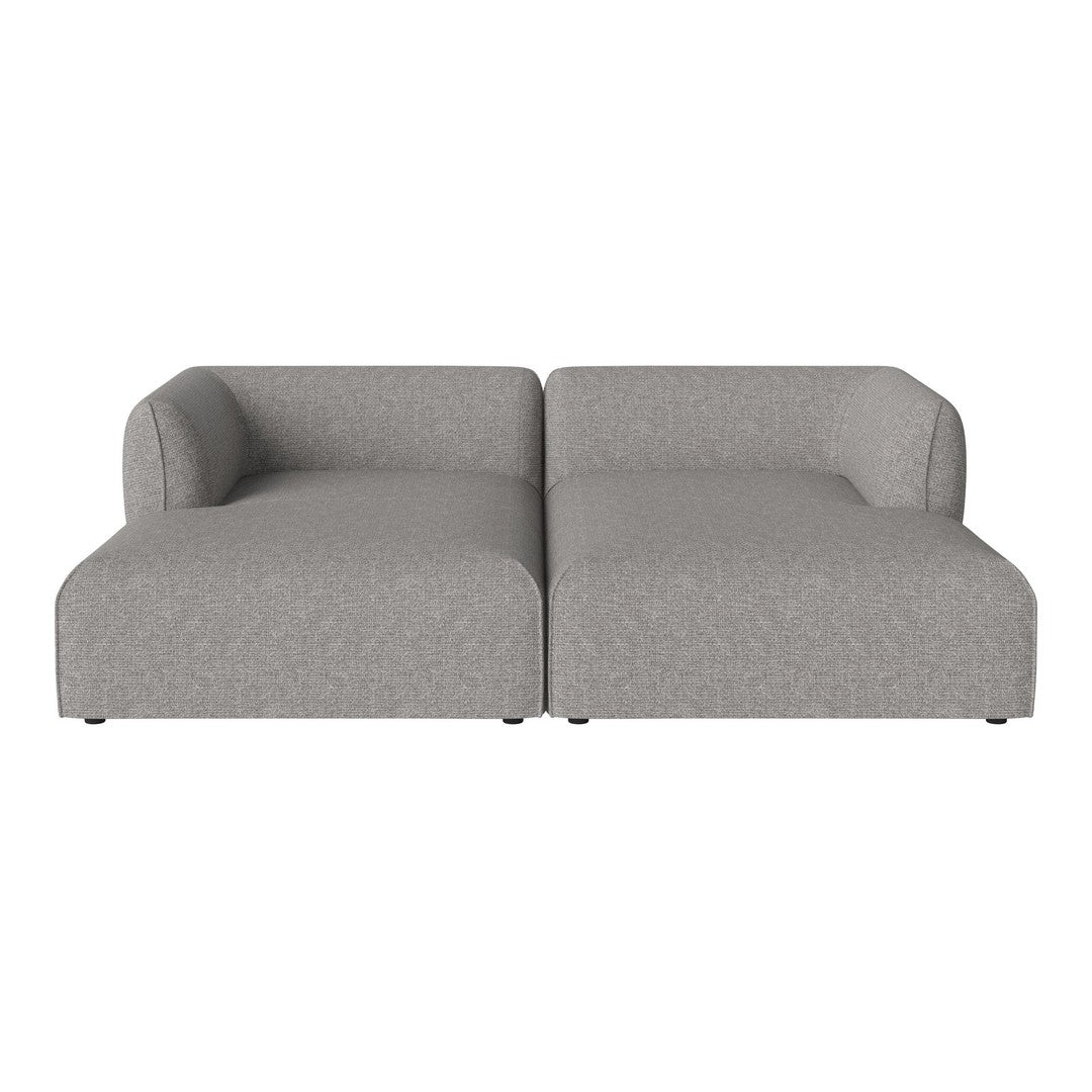 Gray tufted sectional sofa with clean lines and a soft textured fabric pattern. Perfect for modern living spaces.