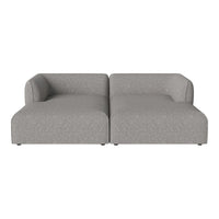 Gray tufted sectional sofa with clean lines and a soft textured fabric pattern. Perfect for modern living spaces.