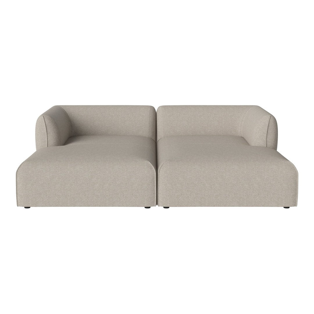 Beige two-piece sofa with smooth fabric and minimalist design, featuring soft edges and no visible patterns.