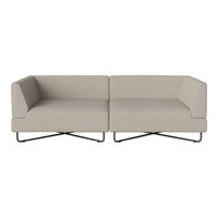 Beige modular sofa with a textured fabric and minimalist design, featuring sleek black metal legs.