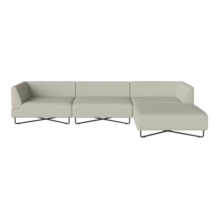 Modern light beige sectional sofa with sleek lines and minimalistic design, featuring black metal legs.