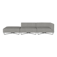 Modern gray sectional sofa with sleek lines and minimalist design, featuring a smooth fabric upholstery and metal legs.