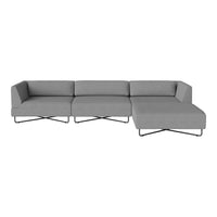 Gray sectional sofa with clean lines and minimalist design, featuring a smooth, solid color fabric and metal legs.