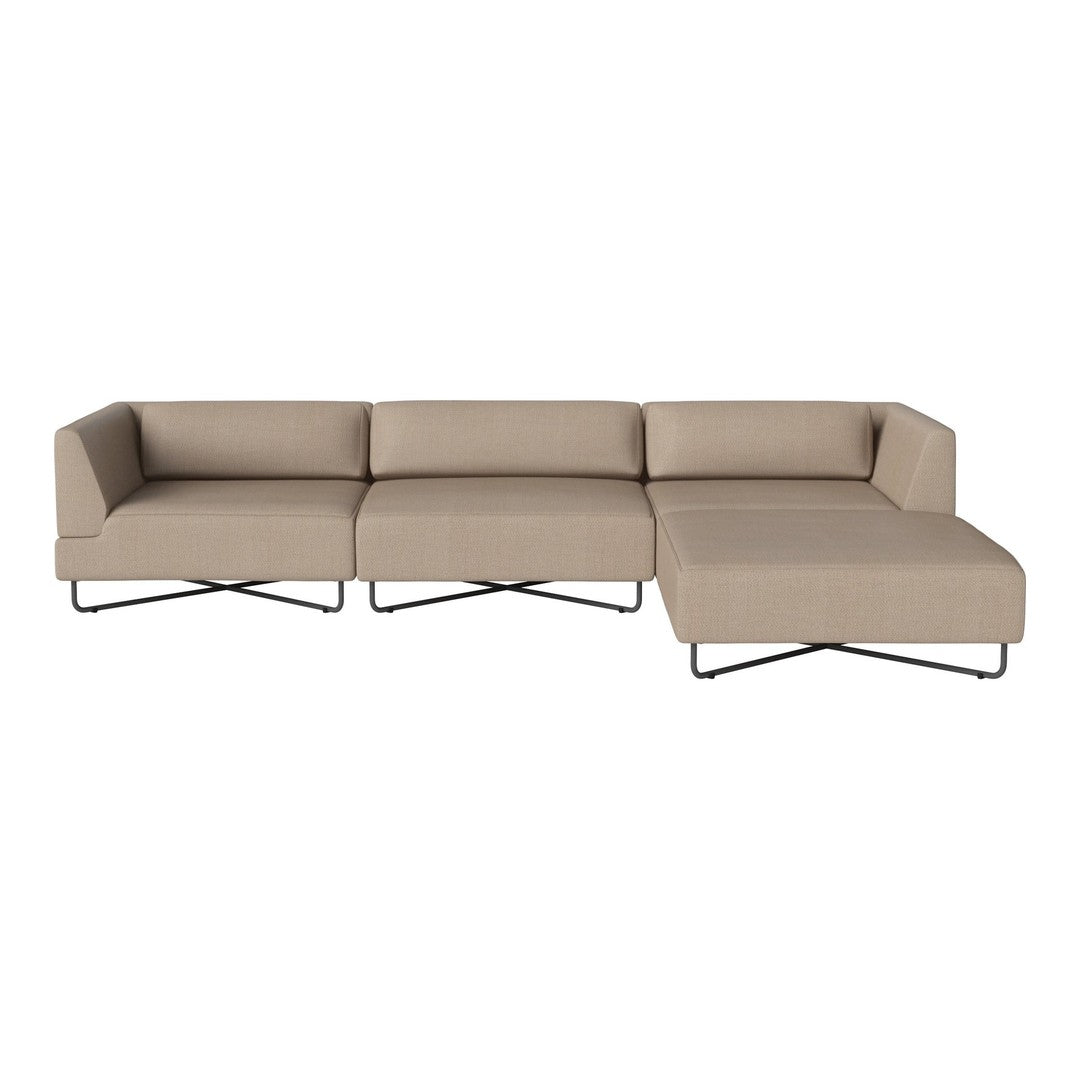 Beige sectional sofa with a minimalist design, featuring clean lines and a smooth fabric texture. Black metal legs.