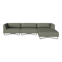 Modern sectional sofa in muted olive green fabric with sleek black metal legs and minimalist design.