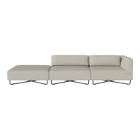 Light gray sectional sofa with sleek lines and minimalist design, featuring a smooth, solid fabric pattern.