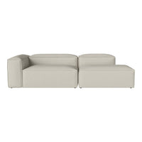 Light gray sectional sofa with a smooth, minimalist design and subtle texture. Perfect for modern interiors.