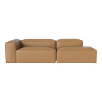 Tan modular sofa with a sleek, modern design and smooth leather finish, perfect for minimalist decor.