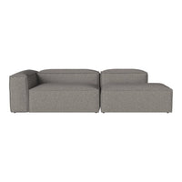 Modern gray sectional sofa with a sleek, minimalist design and subtle textured fabric. Perfect for contemporary spaces.