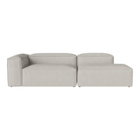 Light grey modular sofa with smooth, minimalist lines and a solid, textured fabric finish. Perfect for modern decor.