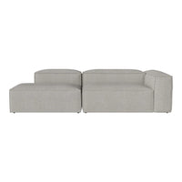 Light gray sectional sofa with a minimalist design and soft, textured upholstery.