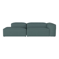 Teal modular sofa with a sleek, minimalist design and textured fabric. Perfect for modern living spaces.