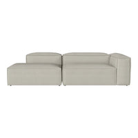 Light gray modular sofa with a smooth, minimalist design, featuring clean lines and no visible patterns.