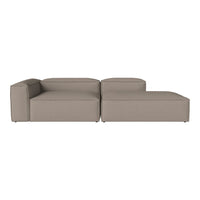 Sleek modular sofa in soft taupe fabric with minimalist design and smooth, clean lines. Modern and versatile for any space.