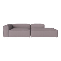 Modern grey sectional sofa with clean lines and minimalistic design, featuring a solid color upholstery.
