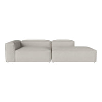 "Modern light gray modular sofa with smooth, minimalist design and subtle texture."