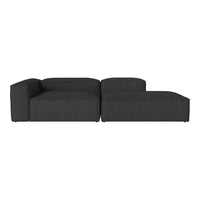 Dark gray sectional sofa with a modern, minimalist design and smooth fabric texture. Ideal for stylish living spaces.