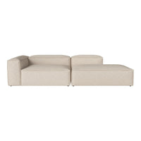 Beige modular sofa with a smooth texture and minimalist design, featuring clean lines and contemporary style.