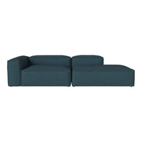 Teal upholstered sectional sofa with a minimalist design and smooth fabric texture.
