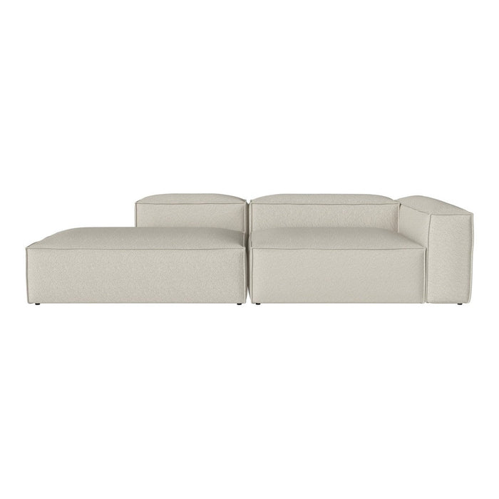 Beige sectional sofa with clean lines and minimalistic design, complementing modern home decor.