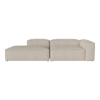 Light beige sectional sofa with clean lines and a minimalist design. Soft fabric with a subtle texture.