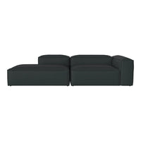 Sleek dark green sectional sofa with a modern, minimalistic design and smooth, textured upholstery.