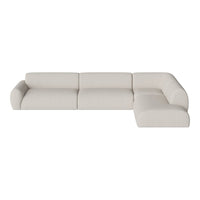 Light beige sectional sofa with a smooth, solid pattern, offering a modern and minimalist aesthetic for any living space.