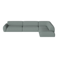 Light gray sectional sofa with a smooth, textured fabric and clean lines, perfect for modern living spaces.