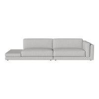 Light grey sectional sofa with clean lines and minimalistic design, featuring a smooth fabric texture.