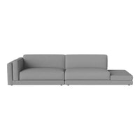 Modern gray sectional sofa with a sleek design and minimalist aesthetic, perfect for any contemporary living space.