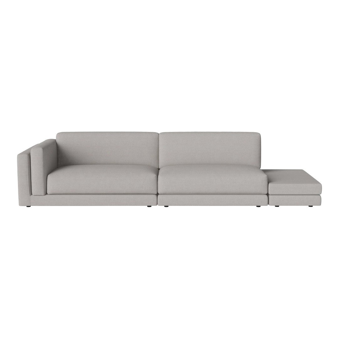 Light gray fabric sectional sofa with clean lines and minimalistic design for contemporary living spaces.