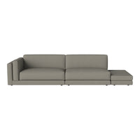 Light grey sectional sofa with a minimalist design and smooth fabric texture, ideal for modern living spaces.