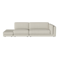 Light beige sectional sofa with a smooth texture and minimalist design, perfect for modern interiors.