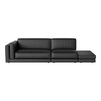 Modern black leather sectional sofa with clean lines and minimalistic design. Perfect for contemporary living spaces.