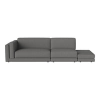 Gray sectional sofa with a minimalist design, featuring a smooth, solid fabric pattern. Ideal for modern interiors.