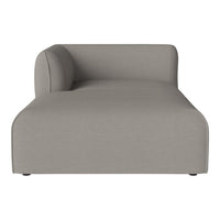 Gray minimalist chaise lounge with smooth, solid fabric pattern and a rounded backrest. Perfect for modern decor.