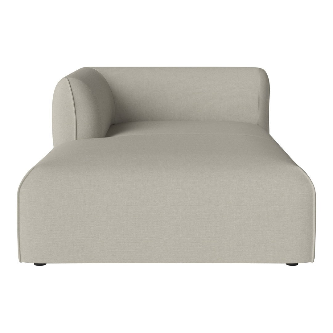 Neutral beige chaise lounge with a smooth, minimalist design and subtle curved armrest, perfect for modern decor.