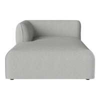 Light gray modern chaise lounge with minimalist design and smooth fabric texture. Ideal for contemporary decor.