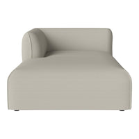 Beige modern chaise lounge featuring a minimalist design and smooth texture. Perfect for contemporary decor.
