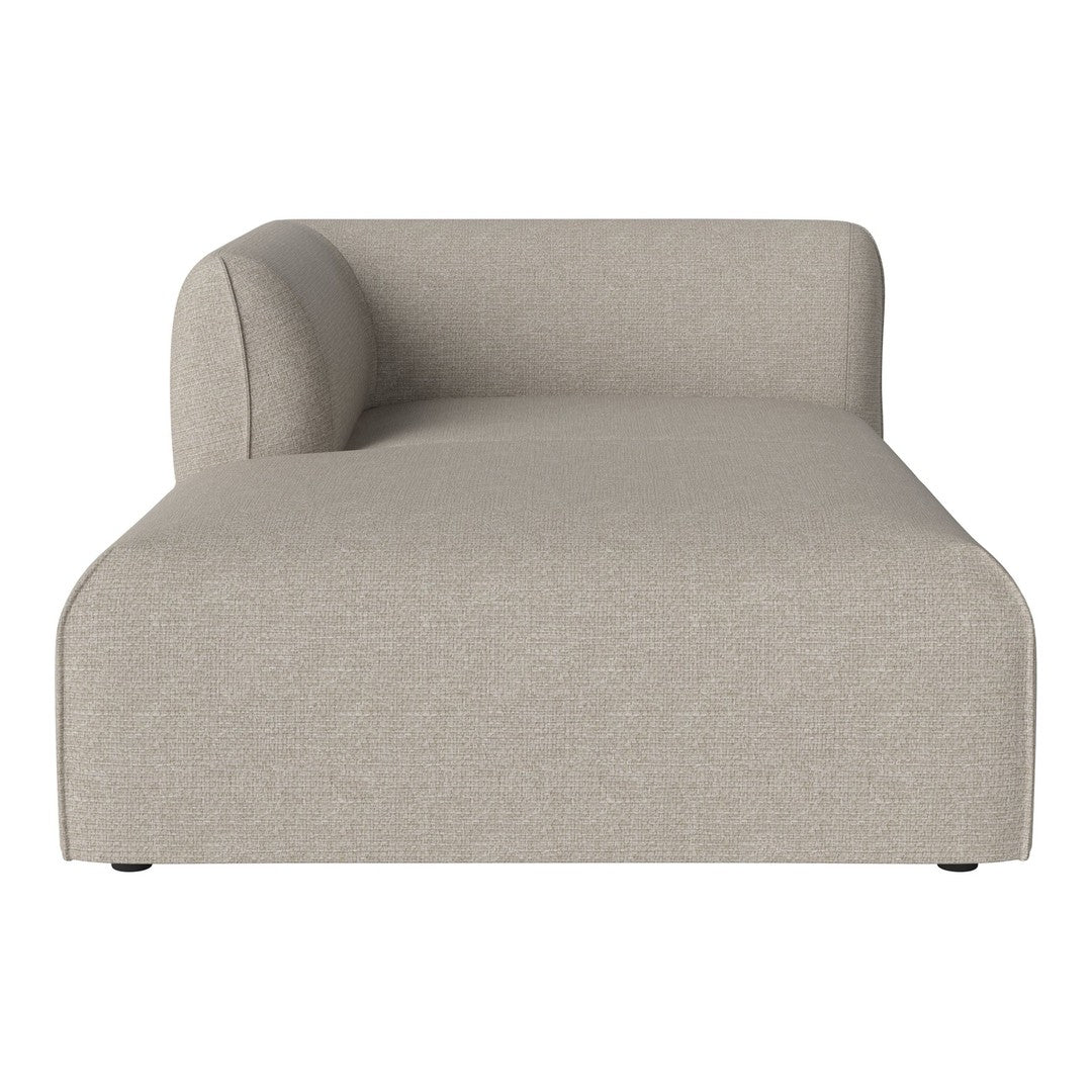 Beige chaise lounge with a smooth, textured fabric and minimalist design. Perfect for modern home decor.