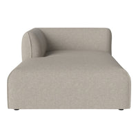 Beige chaise lounge with a smooth, textured fabric and minimalist design. Perfect for modern home decor.