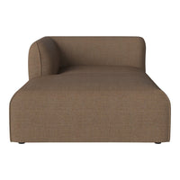 “Textured brown chaise lounge with a sleek, minimalist design and modern curved backrest.”