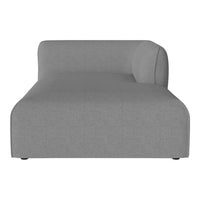 Gray upholstered chaise lounge with a smooth, minimalist design and subtle texture. Perfect for modern living spaces.