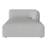 Stretch lounge chair in soft light gray fabric with a smooth, modern design and minimalist silhouette.