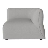 Modern curved sofa in soft light gray fabric, featuring a sleek, minimalist design with no patterns.