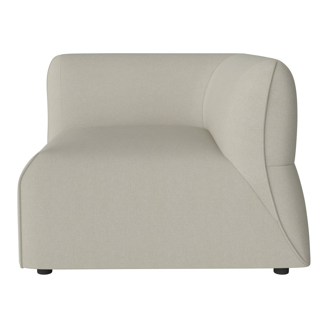 Minimalist beige sectional chair featuring smooth curves and a subtle texture. Perfect for modern interiors.